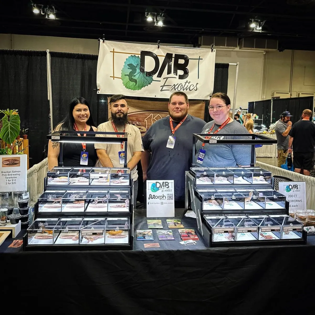 Four vendors behind their display of enclosures