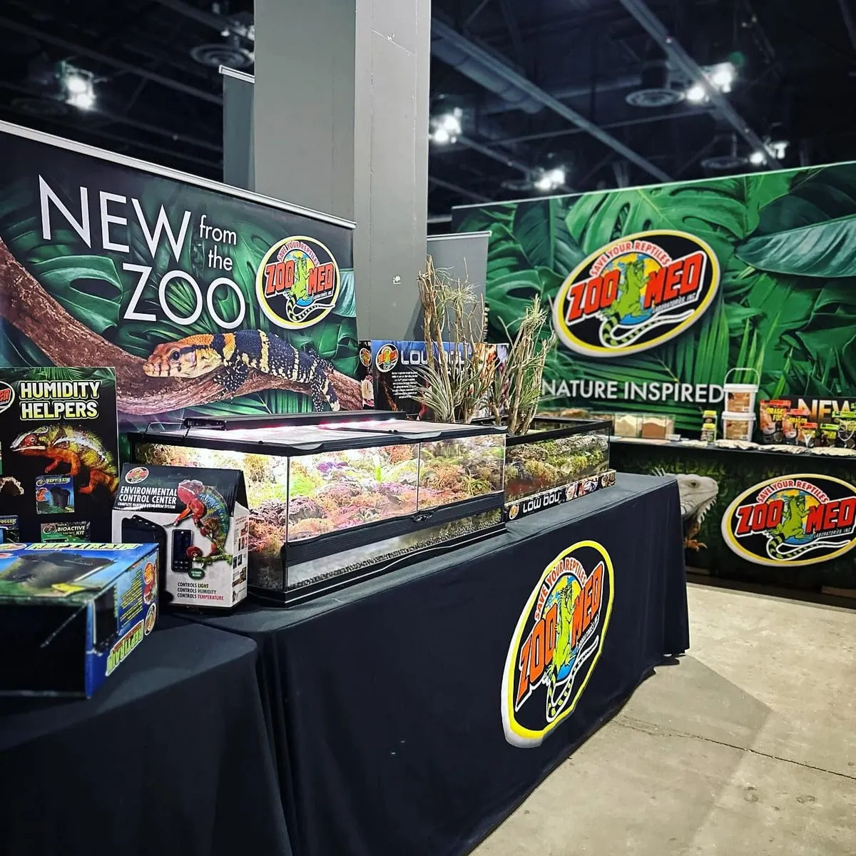 The Zoo Med booth, product displays in front of a jungle backdrop